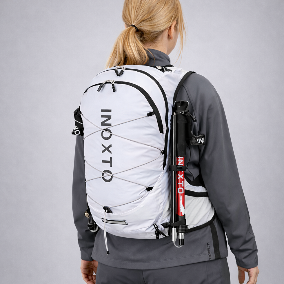 Rear view showing the white backpack fit and exterior pole retention