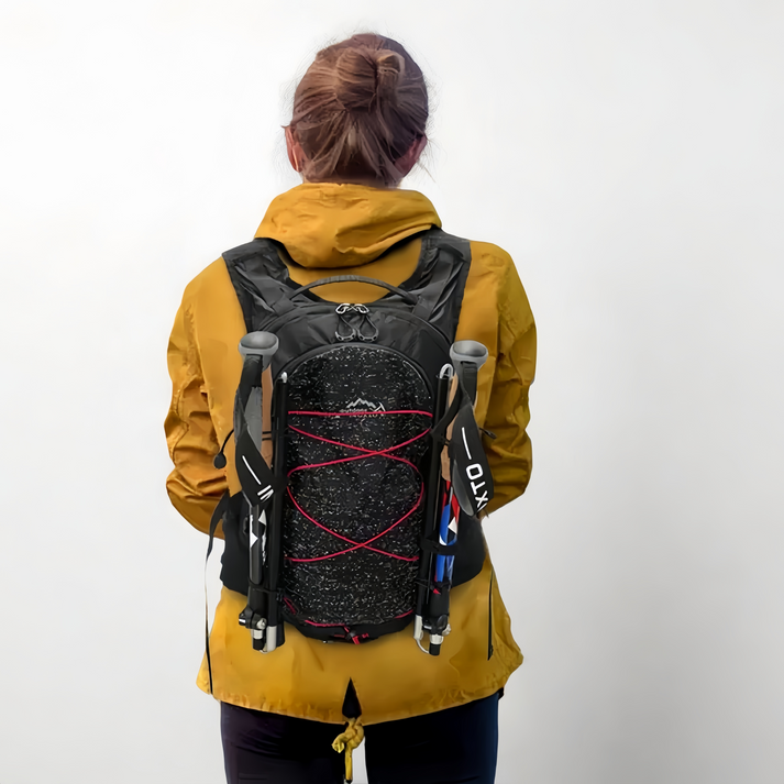 Backpack worn with exterior pole retention
